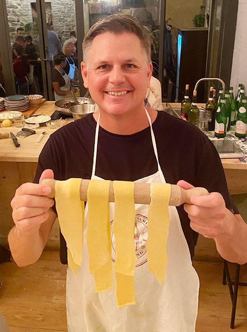 Web Designer Corey Gasman making pasta in Florence, Italy.